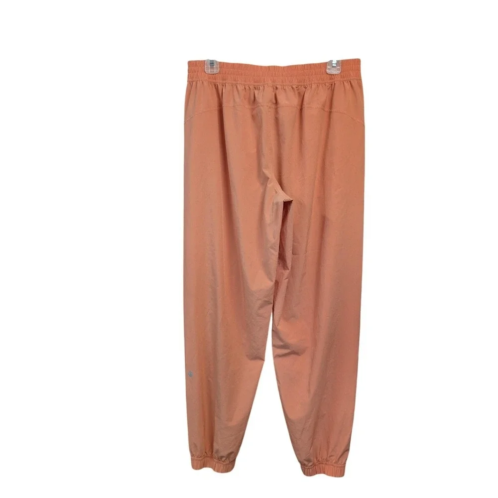 Lululemon Breakaway Track Pants Women 10 Orange Snap Button Joggers Yoga Gym